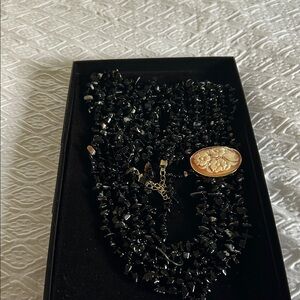 Black Beaded Necklace with Gold Floral Pendant -Cameo attached.